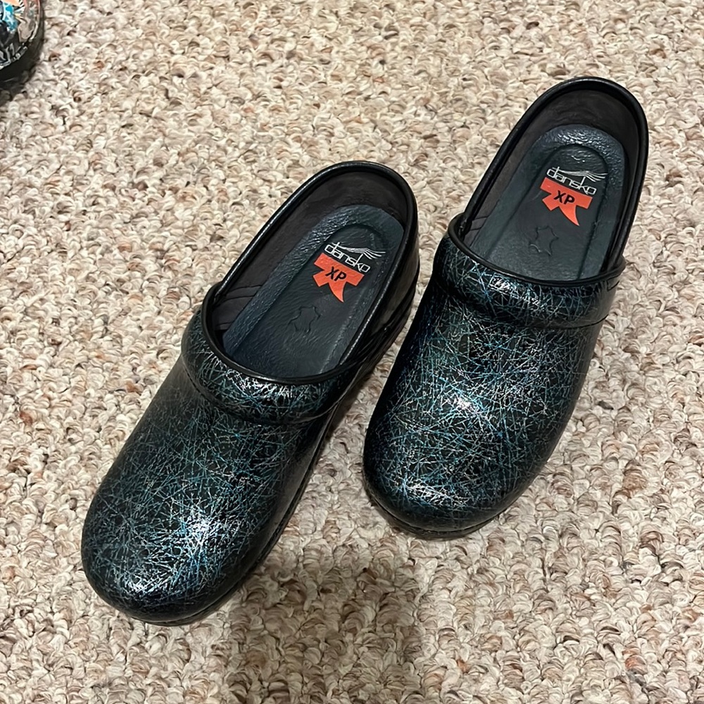 Never worn - Dansko black clogs with teal and a silver detail